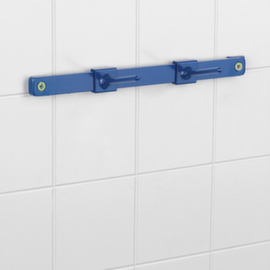 Distributeur mural de sachets liassés